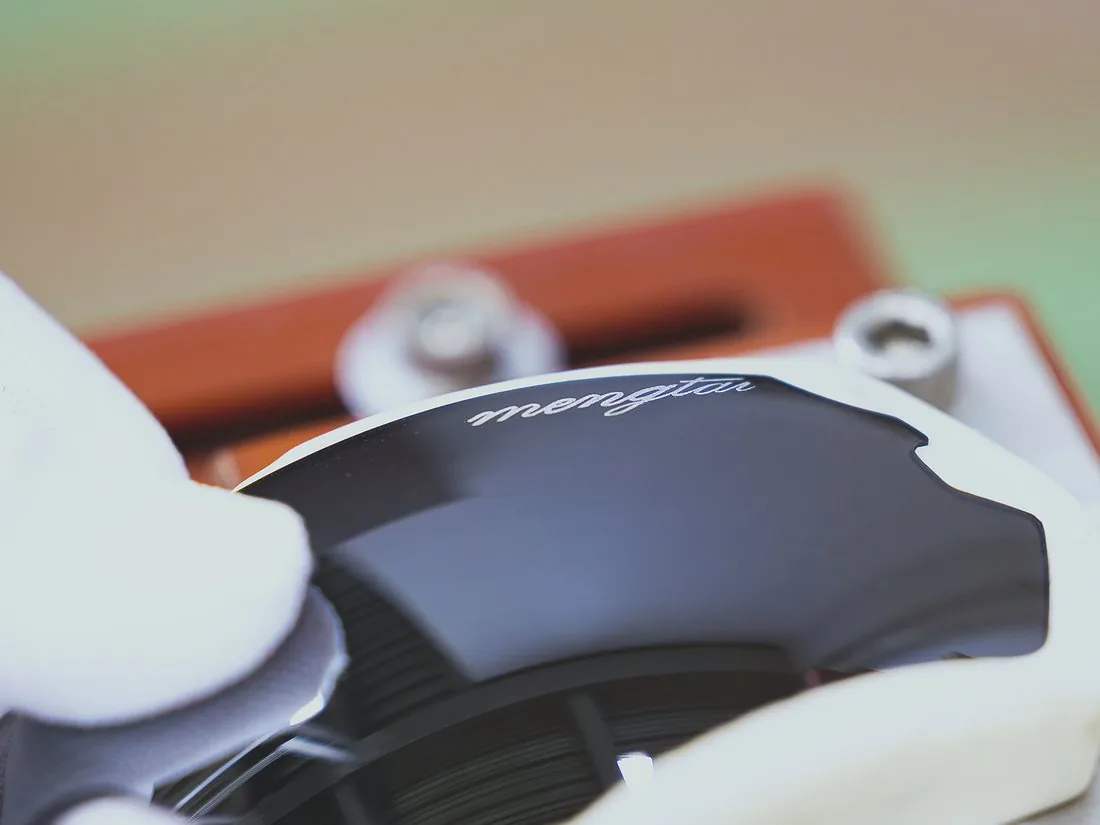 Brand mark printed onto a finished lens